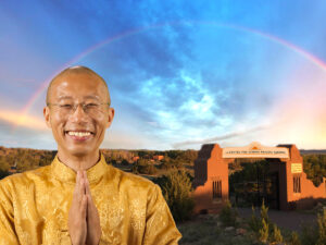 Image features Master Mingtong Gu standing in front of the iconic gate of The Center for Wisdom Healing Qigong, set against a stunning backdrop of a vivid rainbow arching across a serene sky.