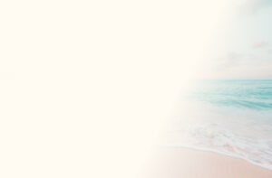 Soft gradient background blending into a serene ocean view, featuring gentle waves meeting the sandy shore under a calm sky, evoking peace and tranquility.