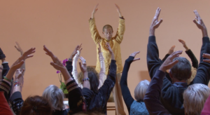 Master Mingtong Gu practicing Qigong with members at The Chi Center