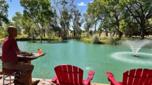 Master Mingtong Gu staring at The Chi Center Koi Pond