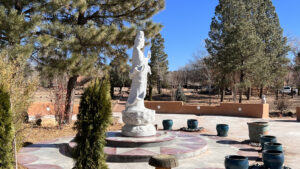 Scenic view of Quanyin Garden against a clear blue sky, capturing the natural beauty and serenity of the Southwest landscape.
