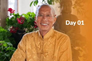 Master Mingtong Gu smiling in a serene garden setting with vibrant flowers and a Buddha statue in the background, overlaid with text reading 'Day 01' on an orange gradient.
