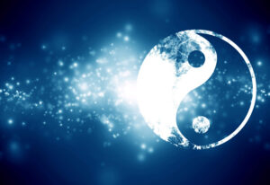 Abstract glowing yin-yang symbol against a deep blue background with sparkling light particles, representing harmony and cosmic balance.