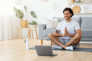 Man meditating in a bright living room