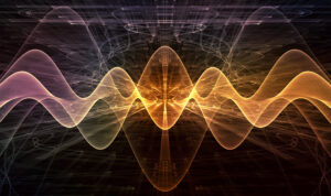 Digital artwork depicting intertwined sound waves in radiant orange and yellow tones, emanating from a central bright source against a complex, dark abstract background, symbolizing energy and vibration.