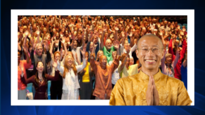 Master Mingtong Gu in traditional golden attire, smiling with hands in a prayer gesture, in front of a vibrant crowd of diverse participants joyfully raising their arms, symbolizing unity, energy, and collective growth in the Qigong for Life Masterclass.